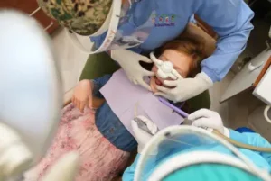 Dentist operating on patient